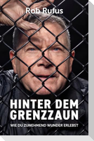 Hinter dem Grenzzaun